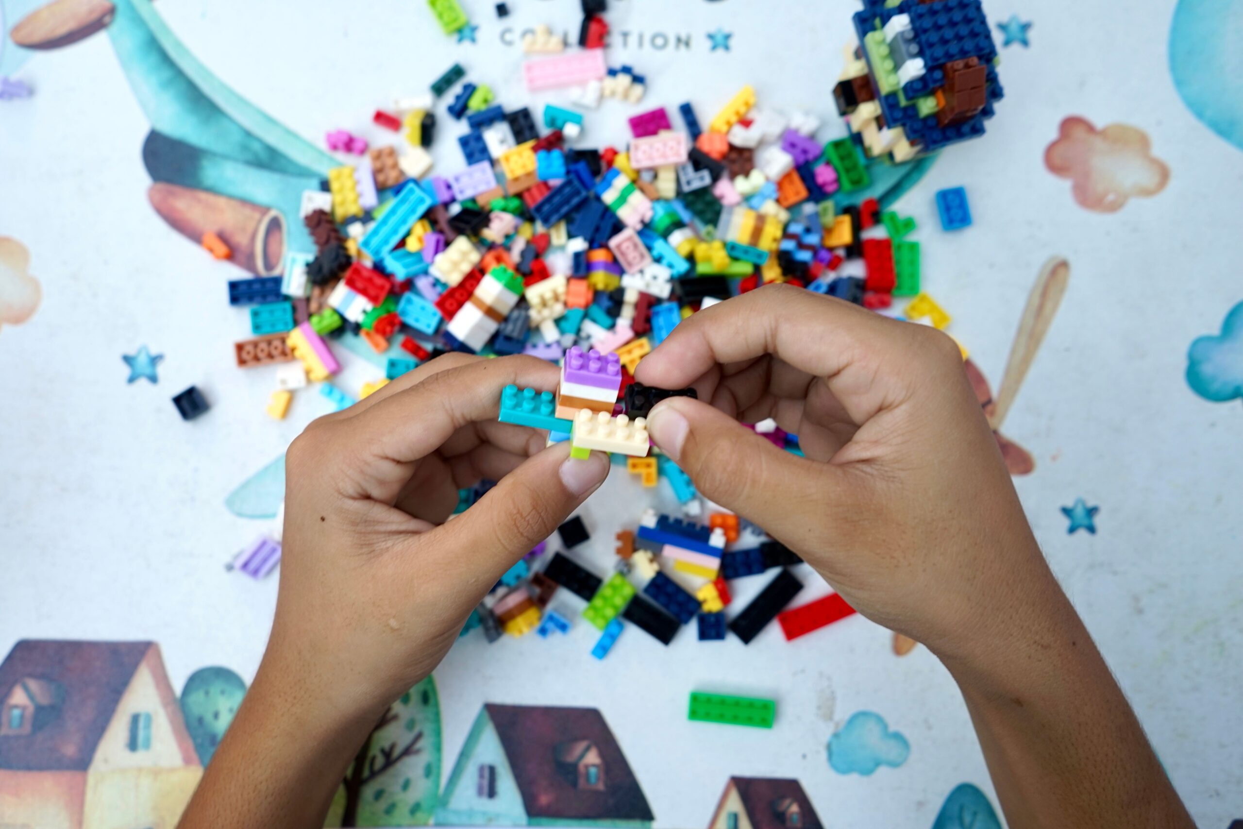 Child building creativity with colorful plastic blocks