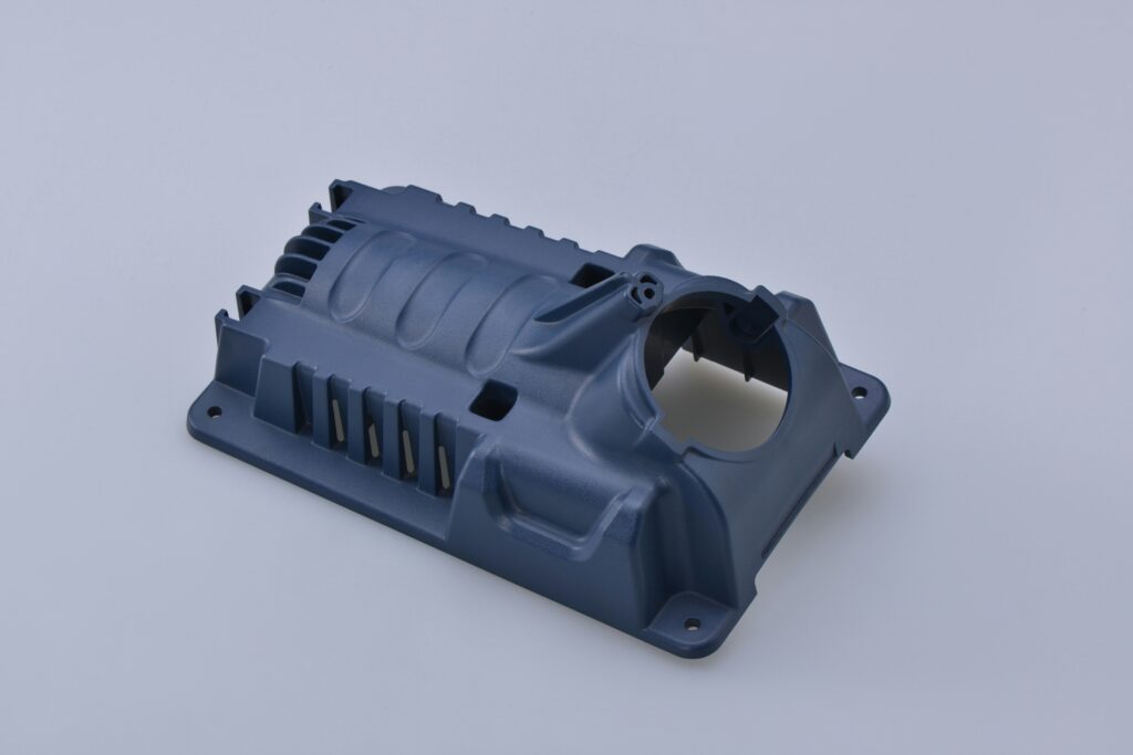 Precision injection-molded plastic enclosure component on a clean studio background