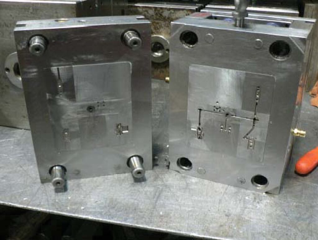 Two-plate injection molding tool (cavity and core halves)